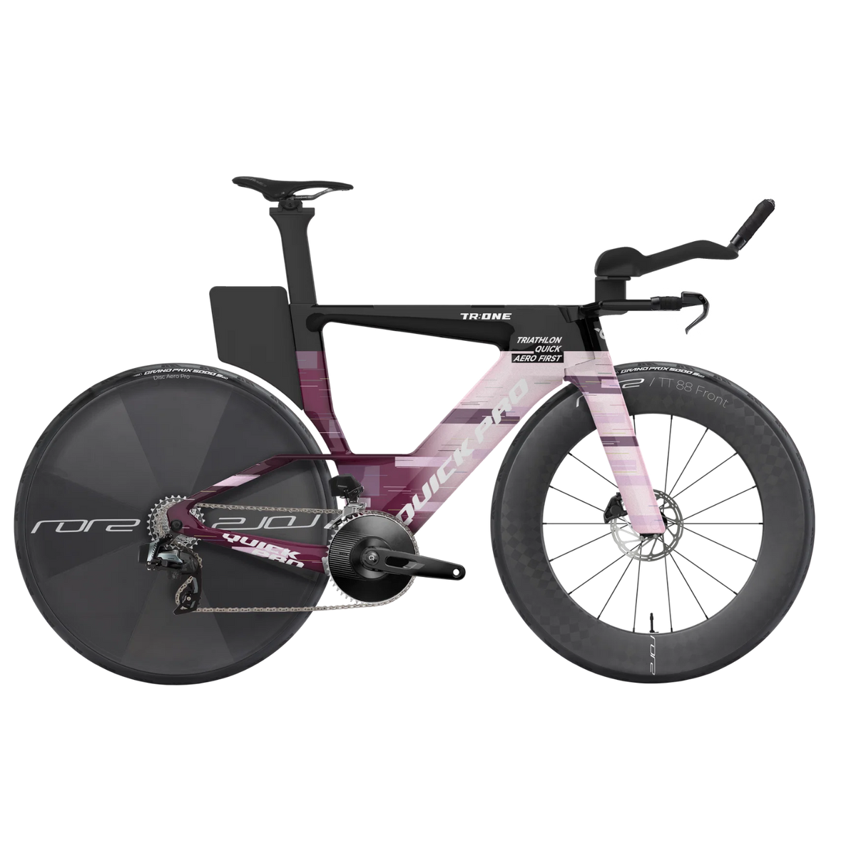 NorVelo TR:ONE triathlon bike in purple and white with aerodynamic frame, disc rear wheel, and carbon aero bars.