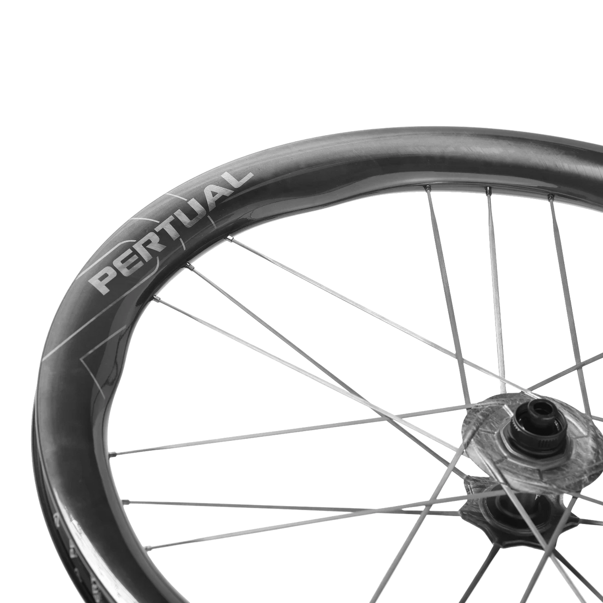 NorVelo carbon fiber bicycle wheel rim with Pertual branding and aerodynamic spokes against a black background