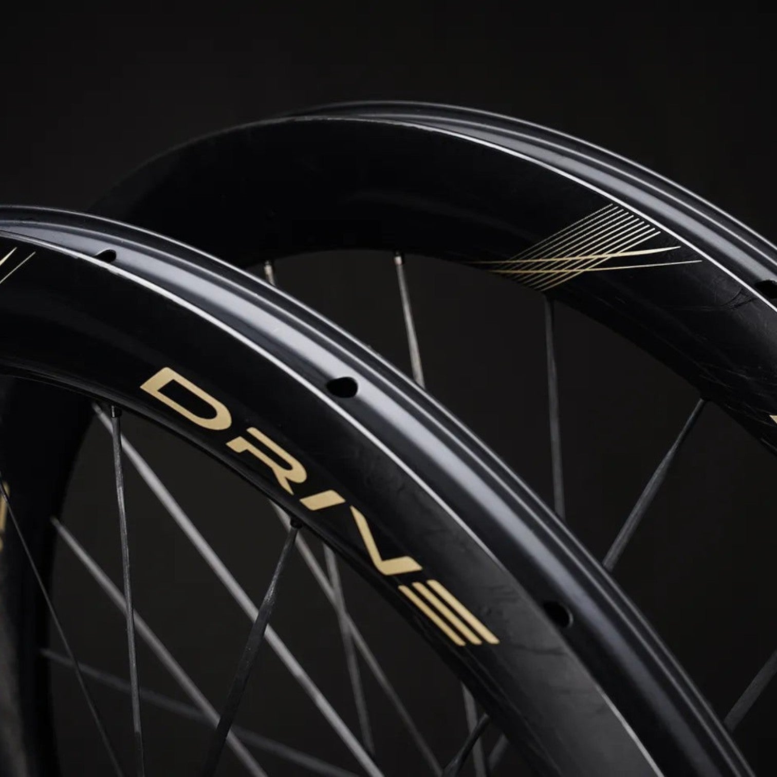 NorVelo Drive 50D II carbon road bike wheels featuring a black aerodynamic rim profile with gold branding details.