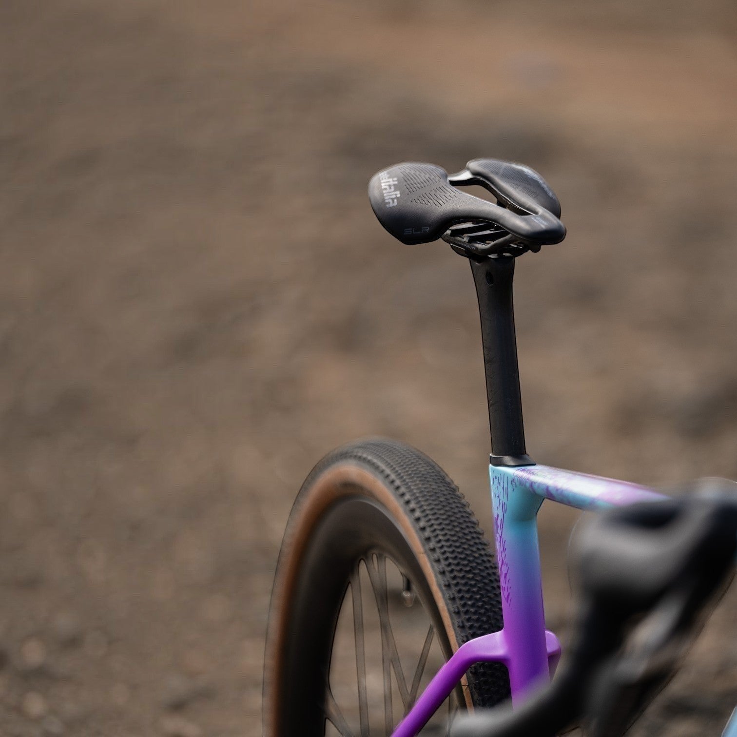 NorVelo Grow aero-gravel bike frame in a vibrant purple and blue gradient finish with a black carbon seatpost.