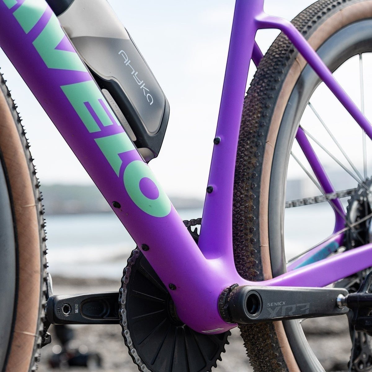 NorVelo Tavelo Grow purple carbon aero gravel bike frame with integrated Fidlock storage and Senicx crankset