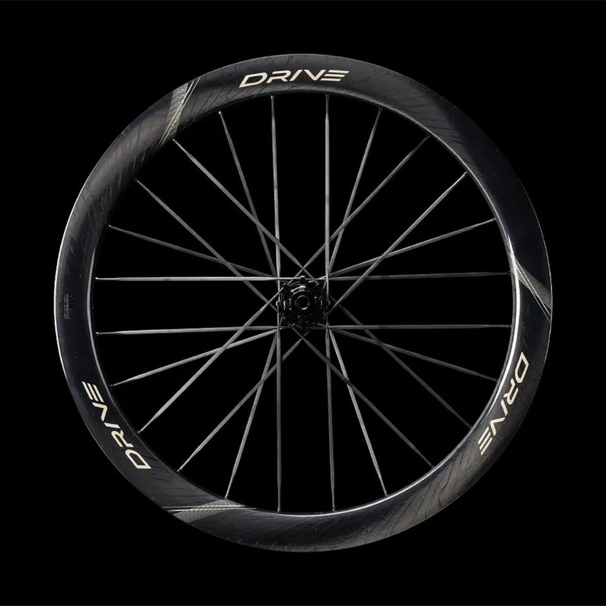 NorVelo Drive 50D II carbon road bike wheel with a 50mm aerodynamic rim profile and black spokes on a black background
