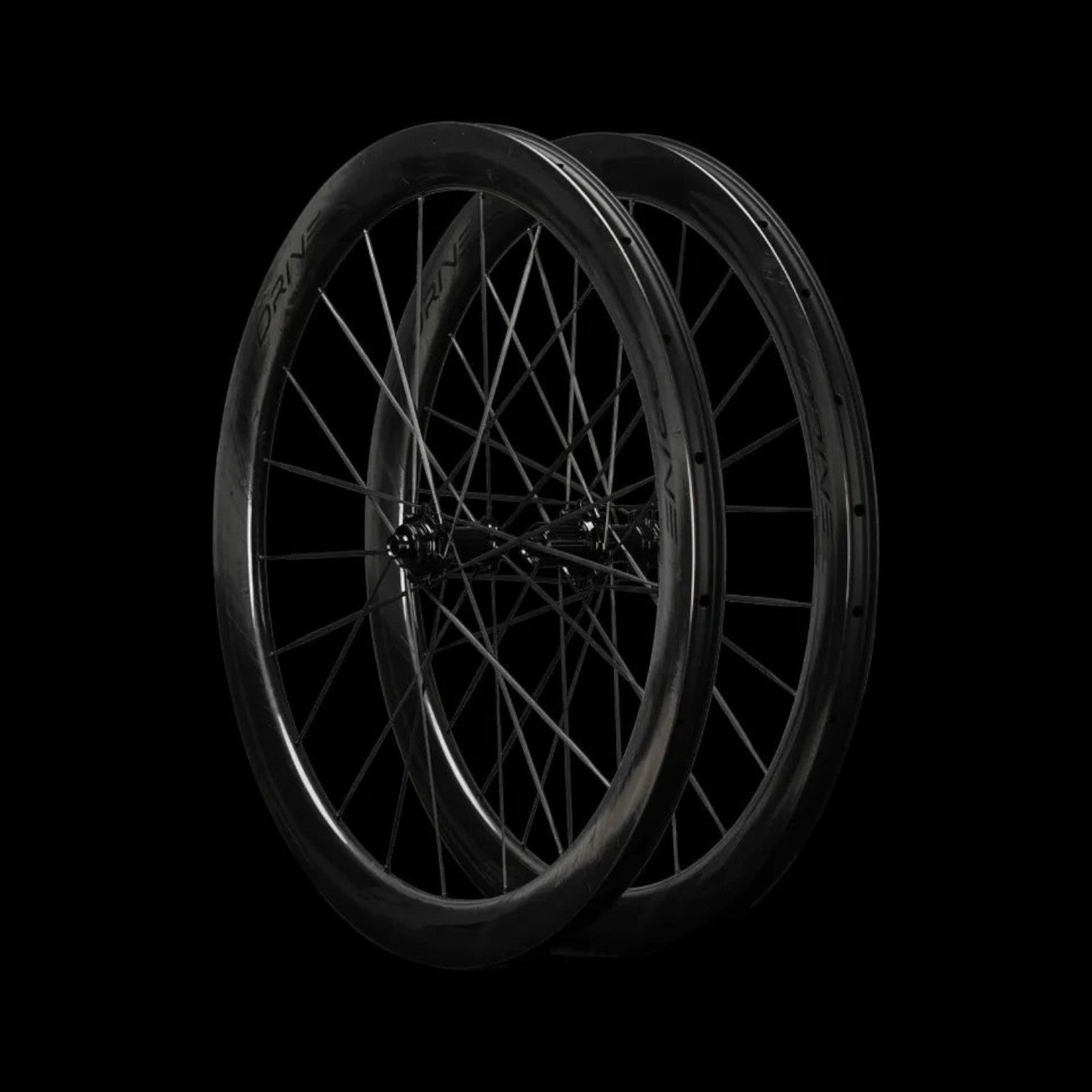 NorVelo Drive 50D II carbon road bike wheelset with aerodynamic U/V-shaped rims in black on a dark background