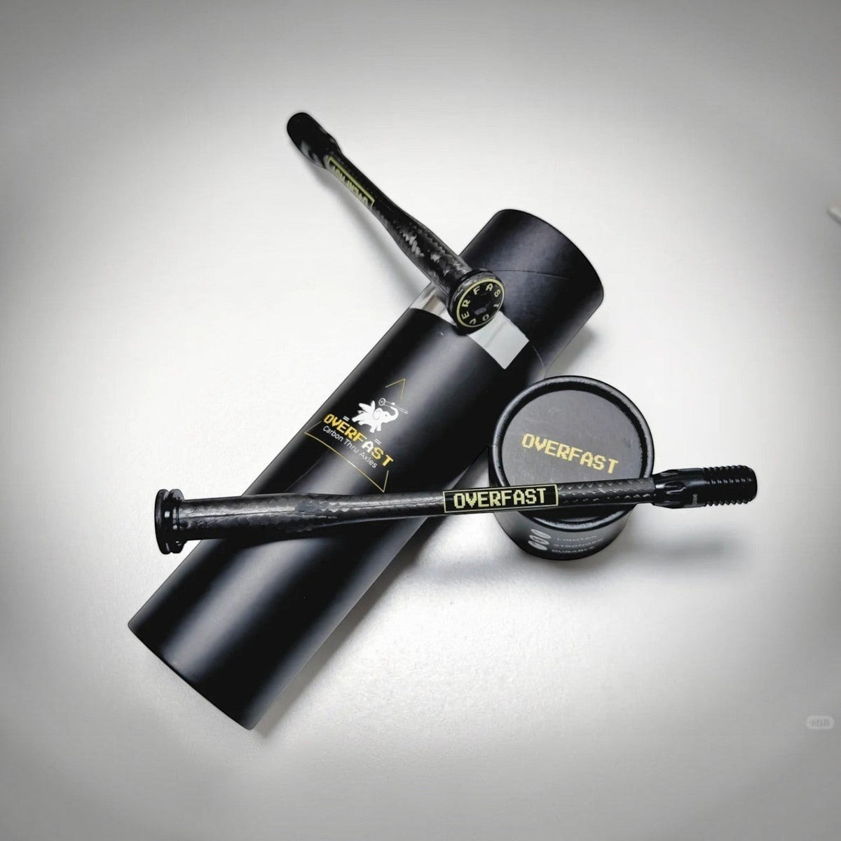 NorVelo OVERFAST ultralight carbon thru axles with titanium inserts and black packaging tube